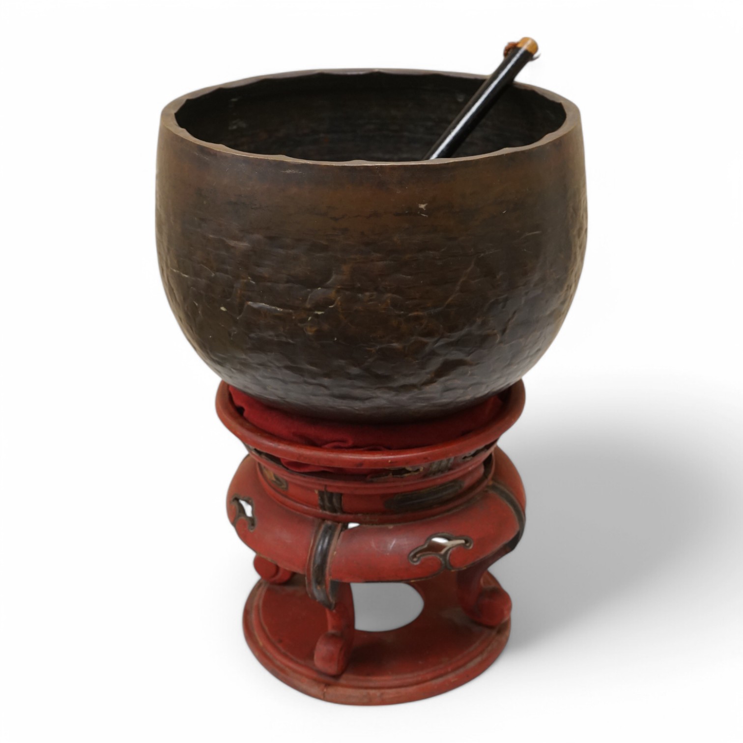 A large Japanese bronze temple bowl with beater, on red lacquered stand. Bowl 33cm diameter. Condition - fair to good